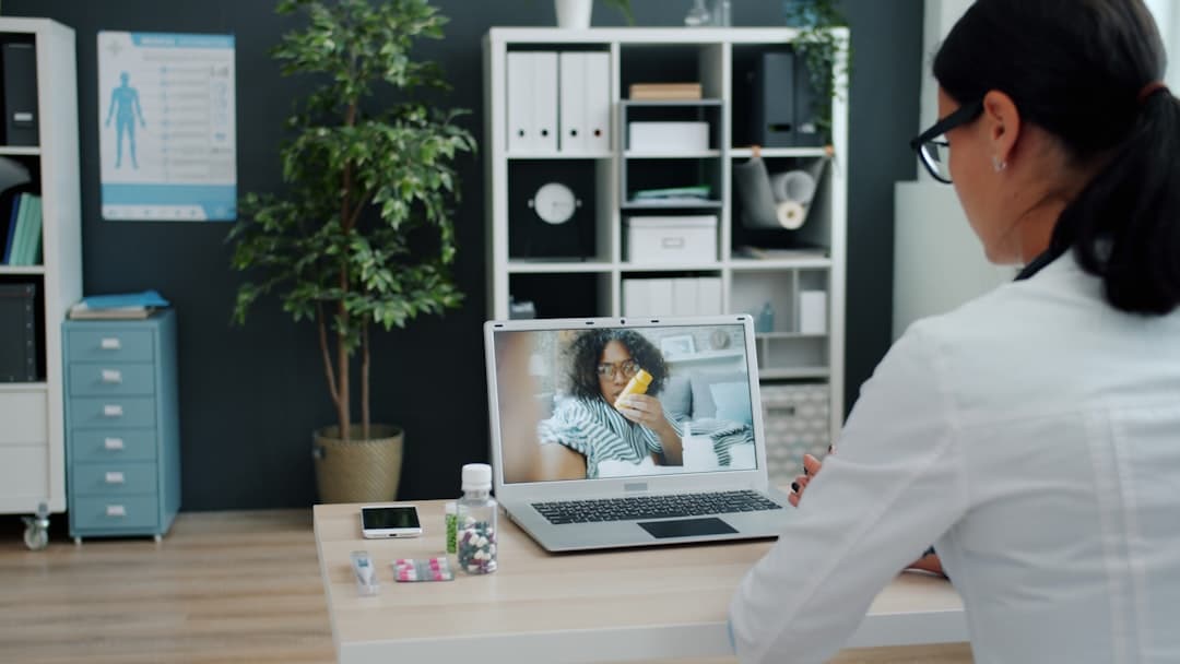 A doctor consulting a patient in a modern digital clinic