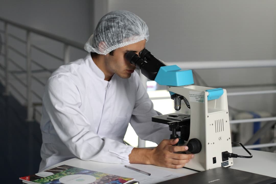 A lab technician analysing samples in a modern diagnostic pathology laboratory
